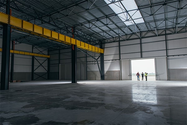 empty warehouse with two men in green river wy