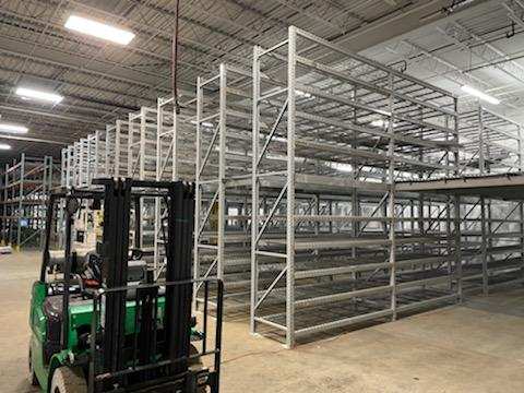 forklift surrounded by dakota storage pallet racking
